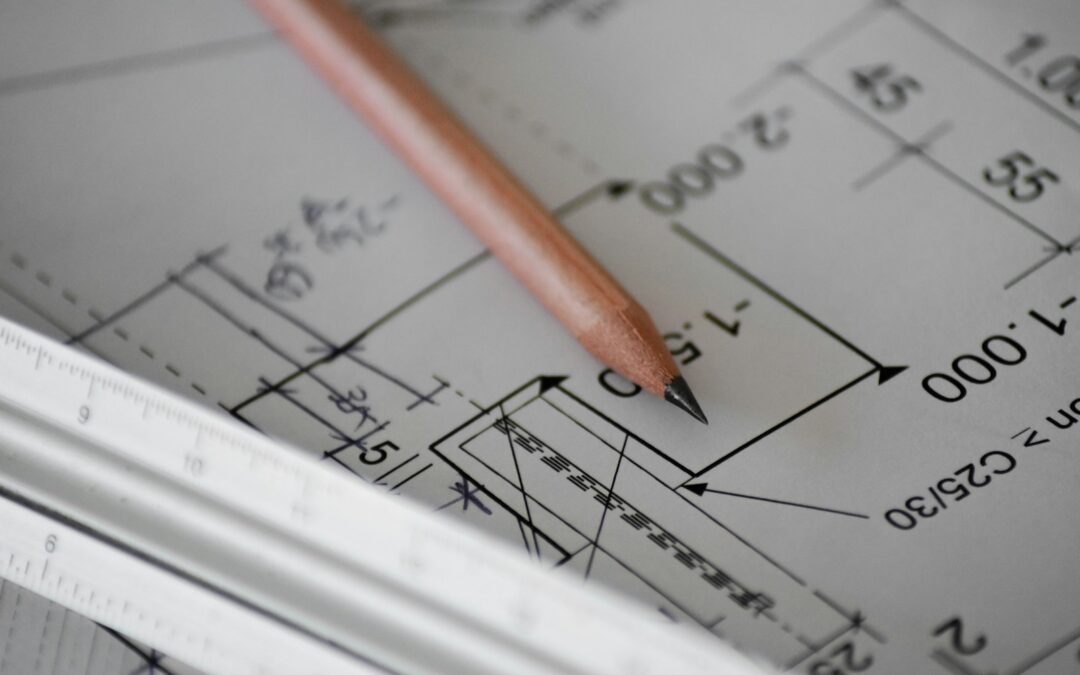 Pencil resting on architectural plans