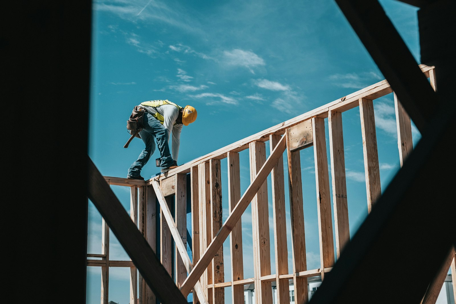Construction worker on a new home frame